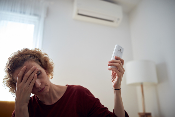 Woman Frustrated with dying AC Unit